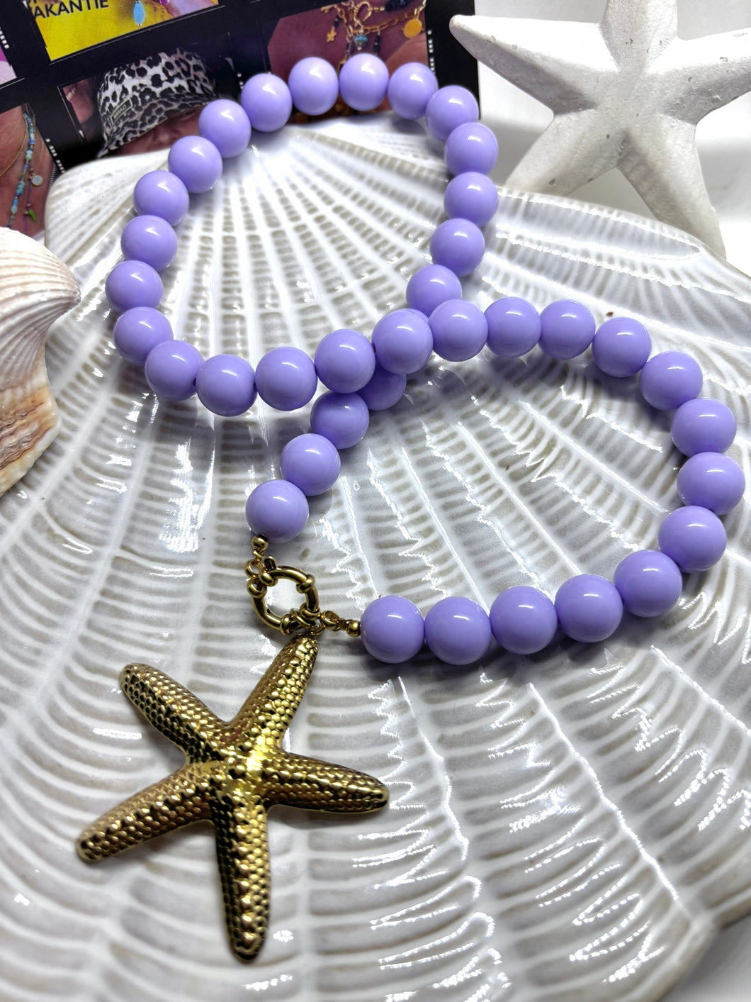 Lila Kralenketting met boeislot en zeester bedel