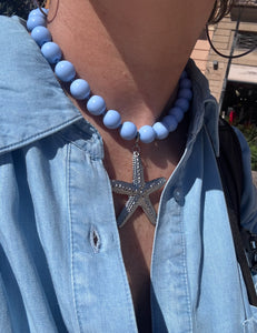 Blauwe kralenketting met grote zeester