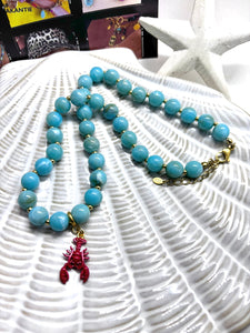 Blauwe kralenketting met afneembare kreeft bedel