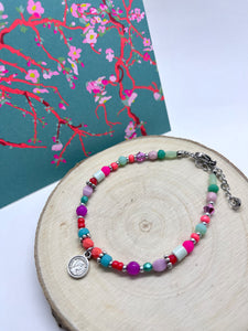 Zilverkleurige kralenarmband “orange multi”